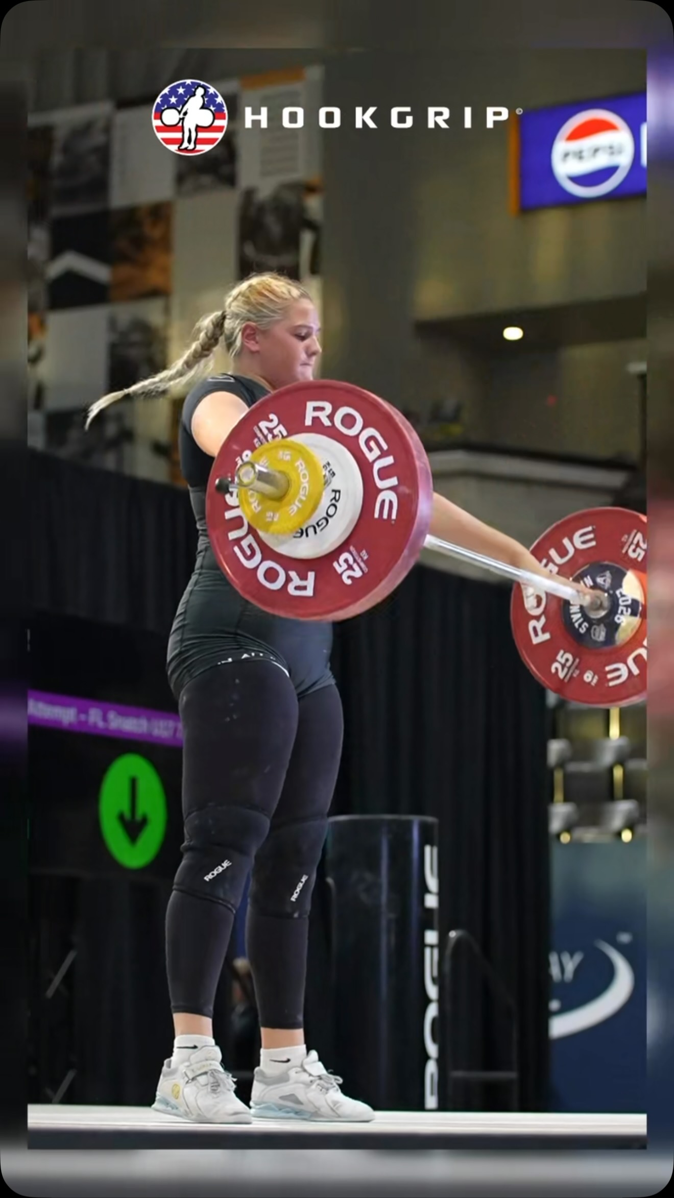 Weightlifter completing a competition lift